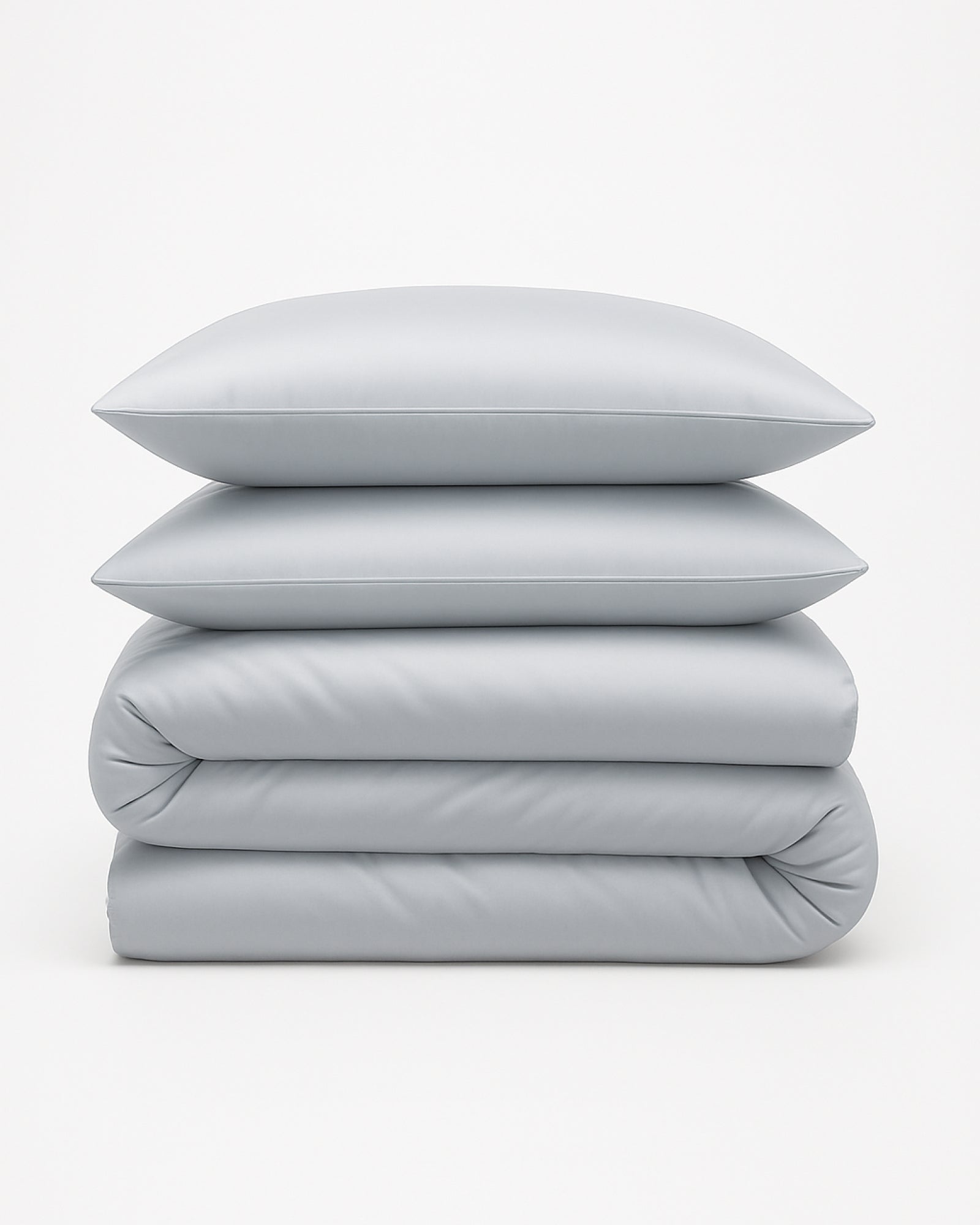 Calm Grey Tencel Sateen duvet cover set folded with matching pillowcases stacked on top.