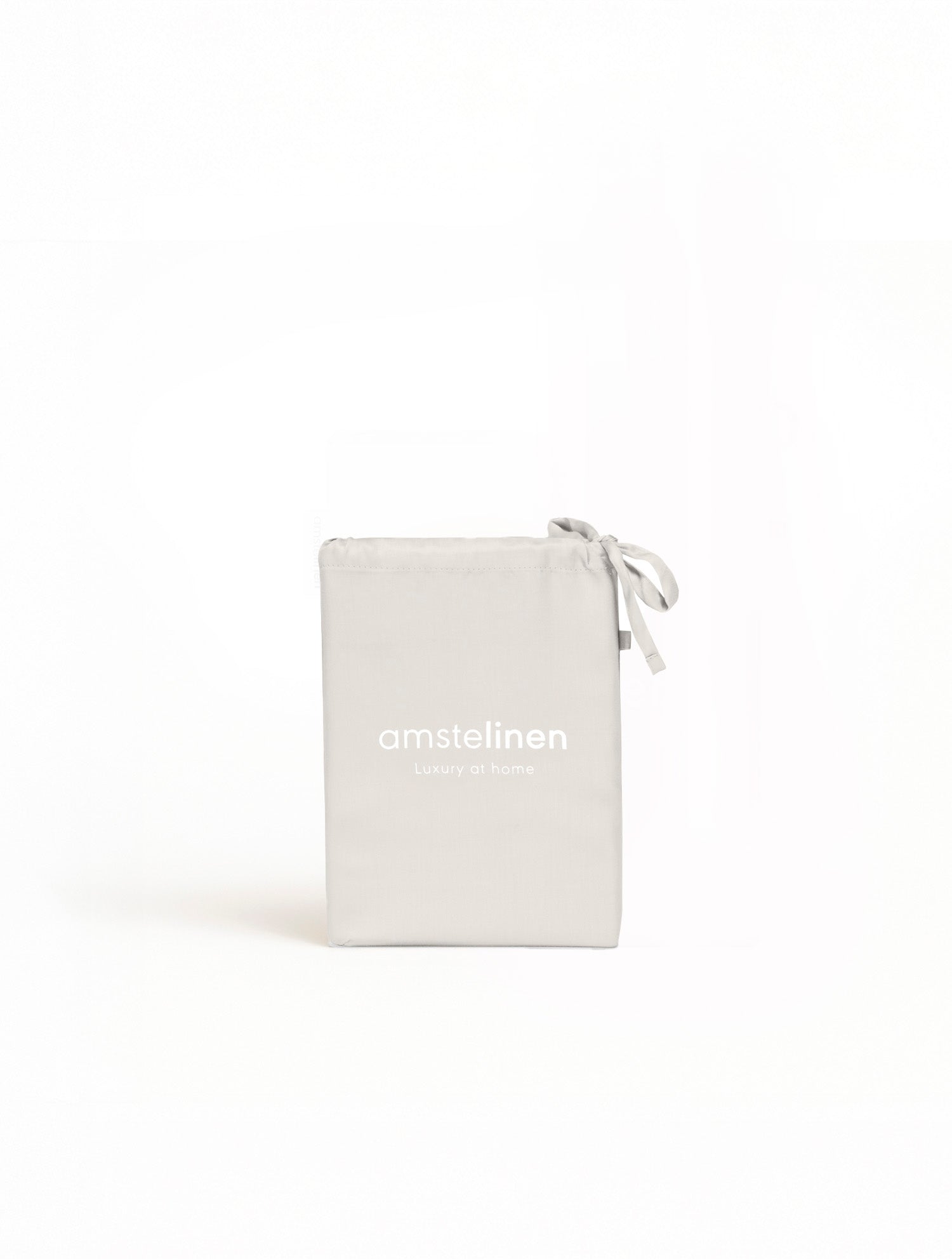 Soft ivory Tencel™ sateen pillowcase with drawstring closure, folded neatly.