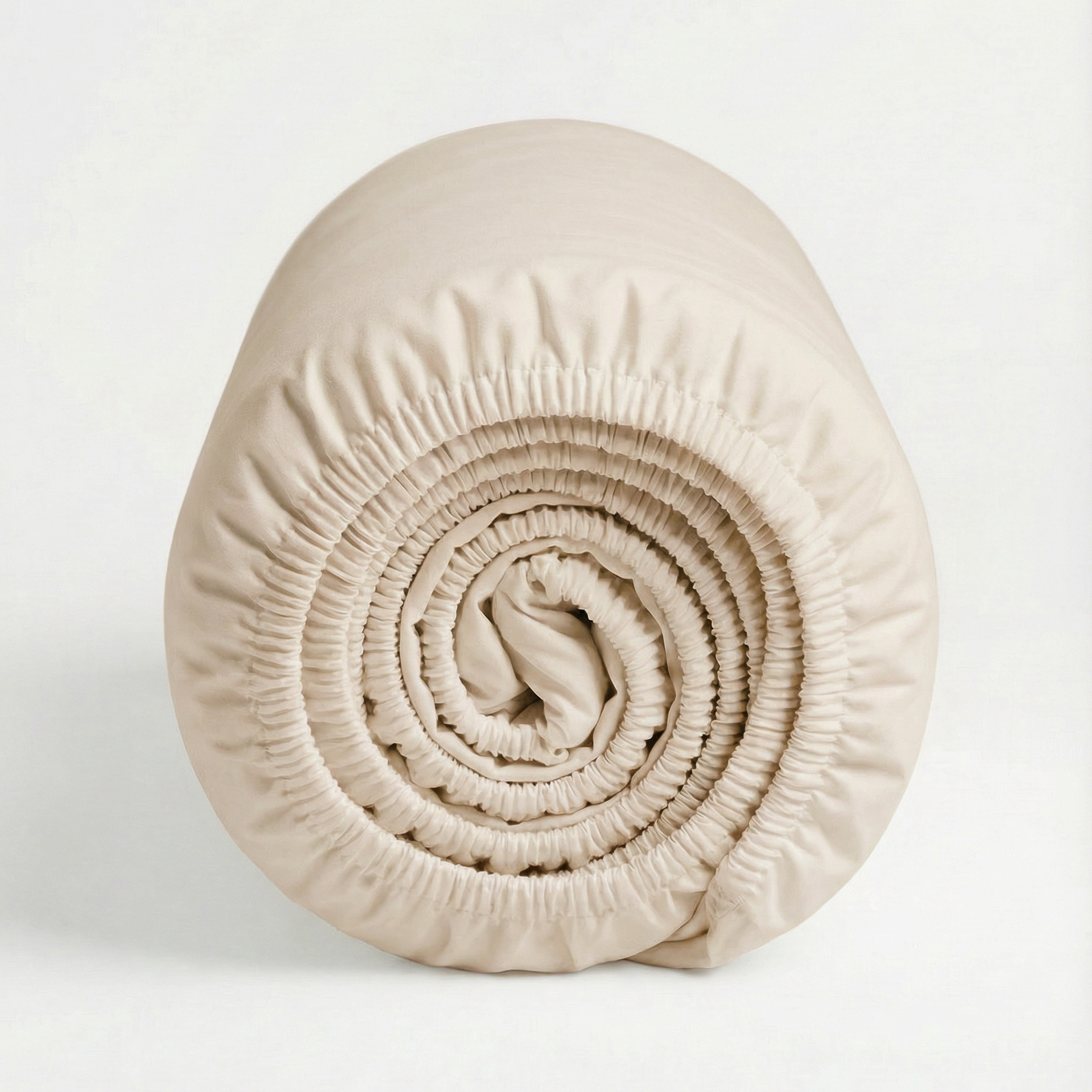 Rolled Classic Ivory Tencel™ sateen fitted sheet with elastic edges.