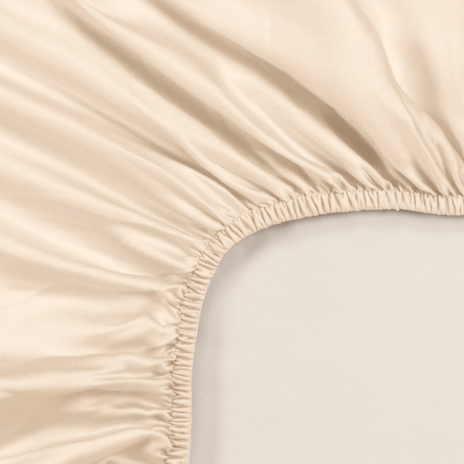 Classic ivory fitted sheet with smooth Tencel™ sateen fabric and elastic edges.