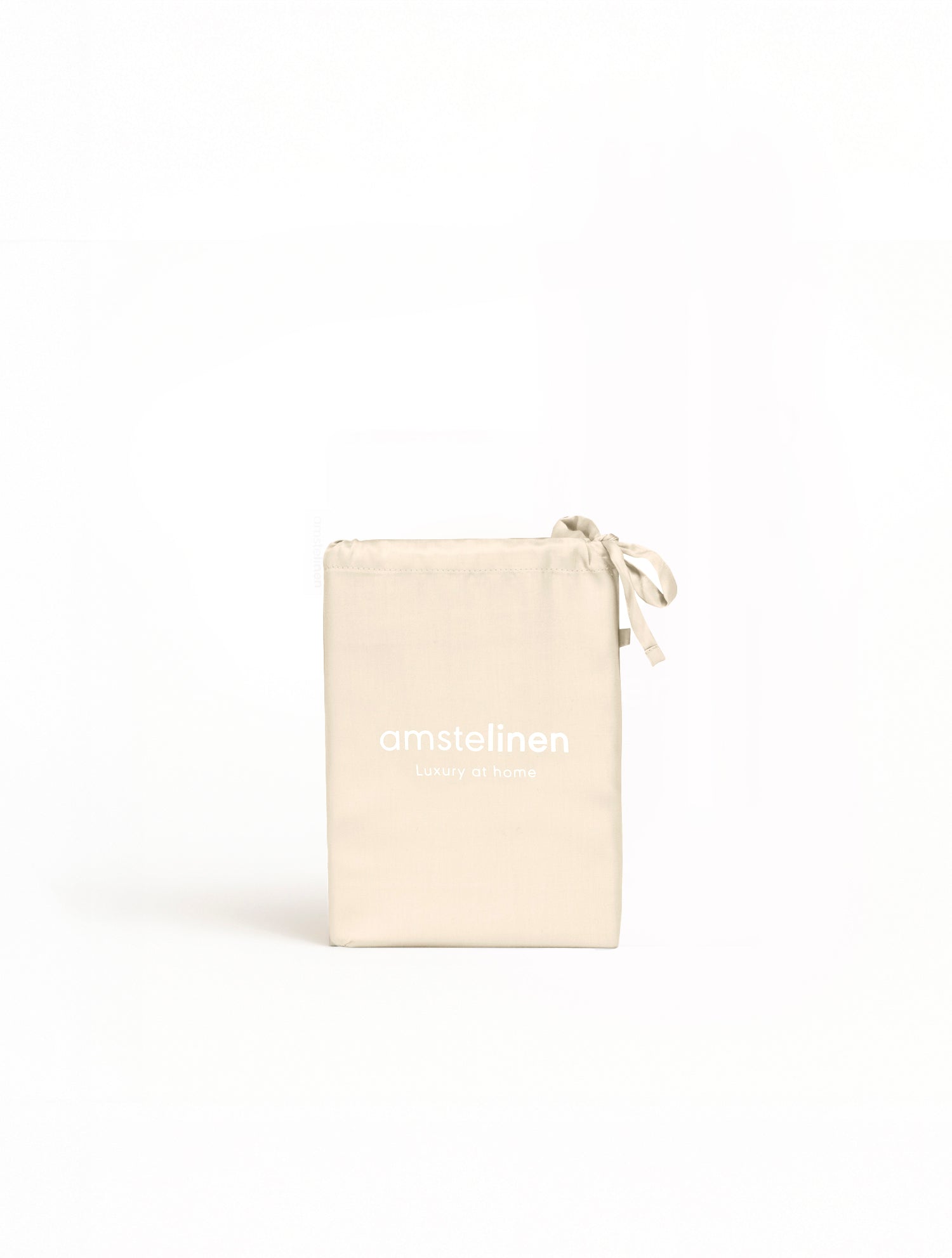 Classic Ivory Tencel Sateen Pillowcase folded with drawstring pouch on white background.
