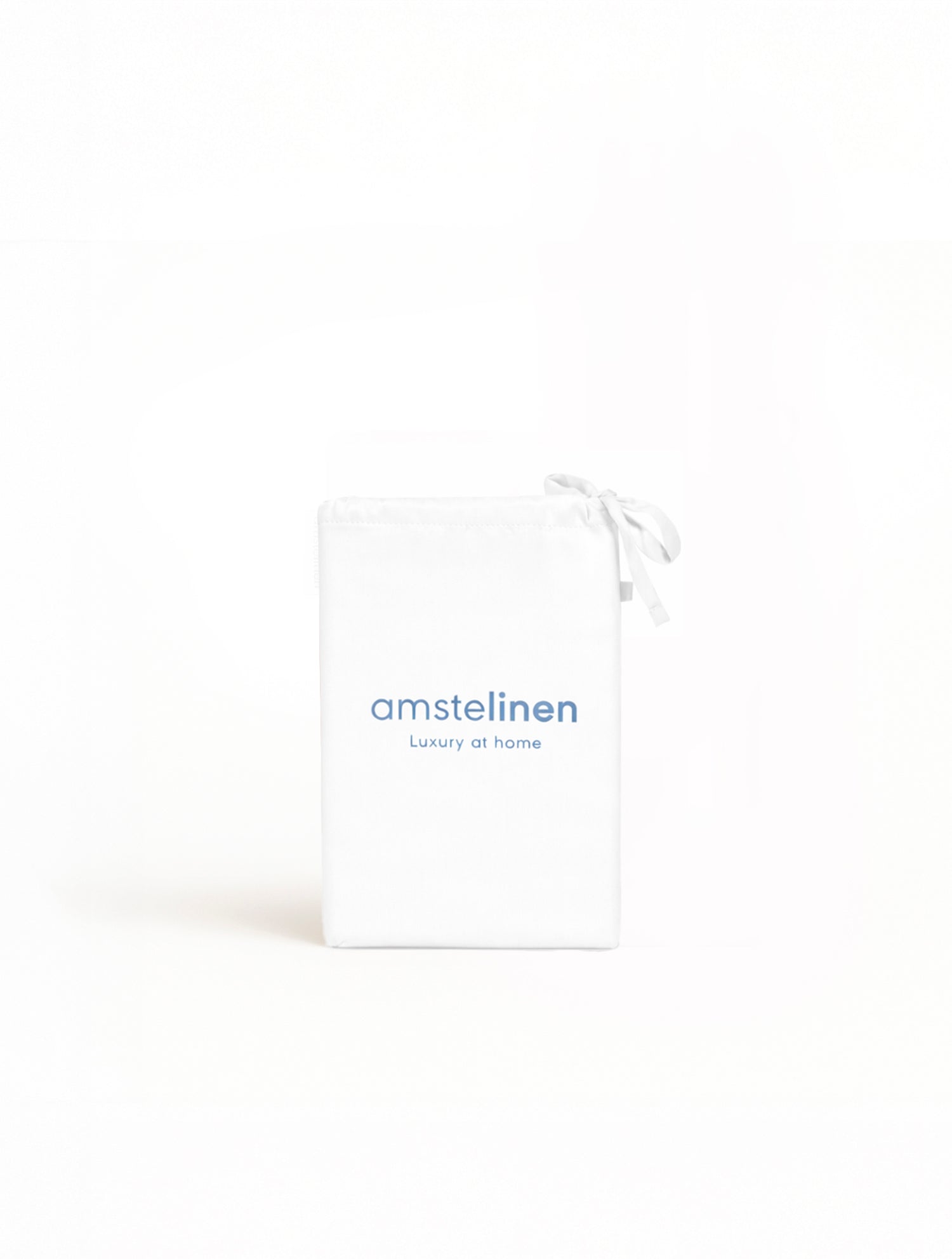 White Tencel™ sateen pillowcase folded with branded packaging label.