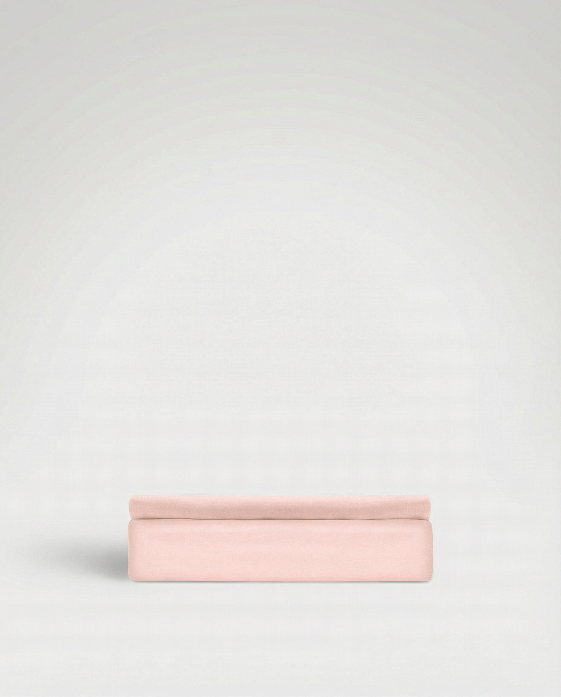 Folded soft pink Tencel sateen flat sheet with smooth, lustrous finish on a plain background.