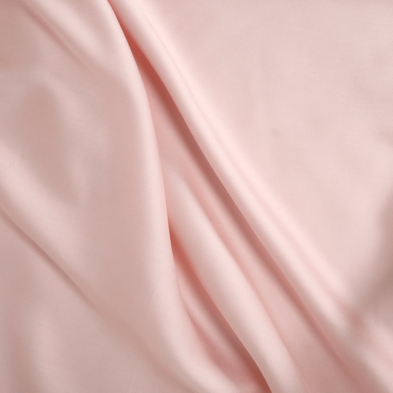Smooth Tencel sateen fabric in soft Whisper Rose pink with subtle draping and sheen.
